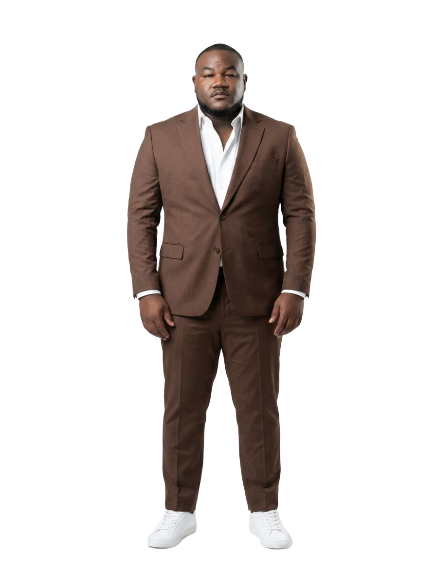 Eric, founder of PhoneKingz, standing in a brown tailored suit
